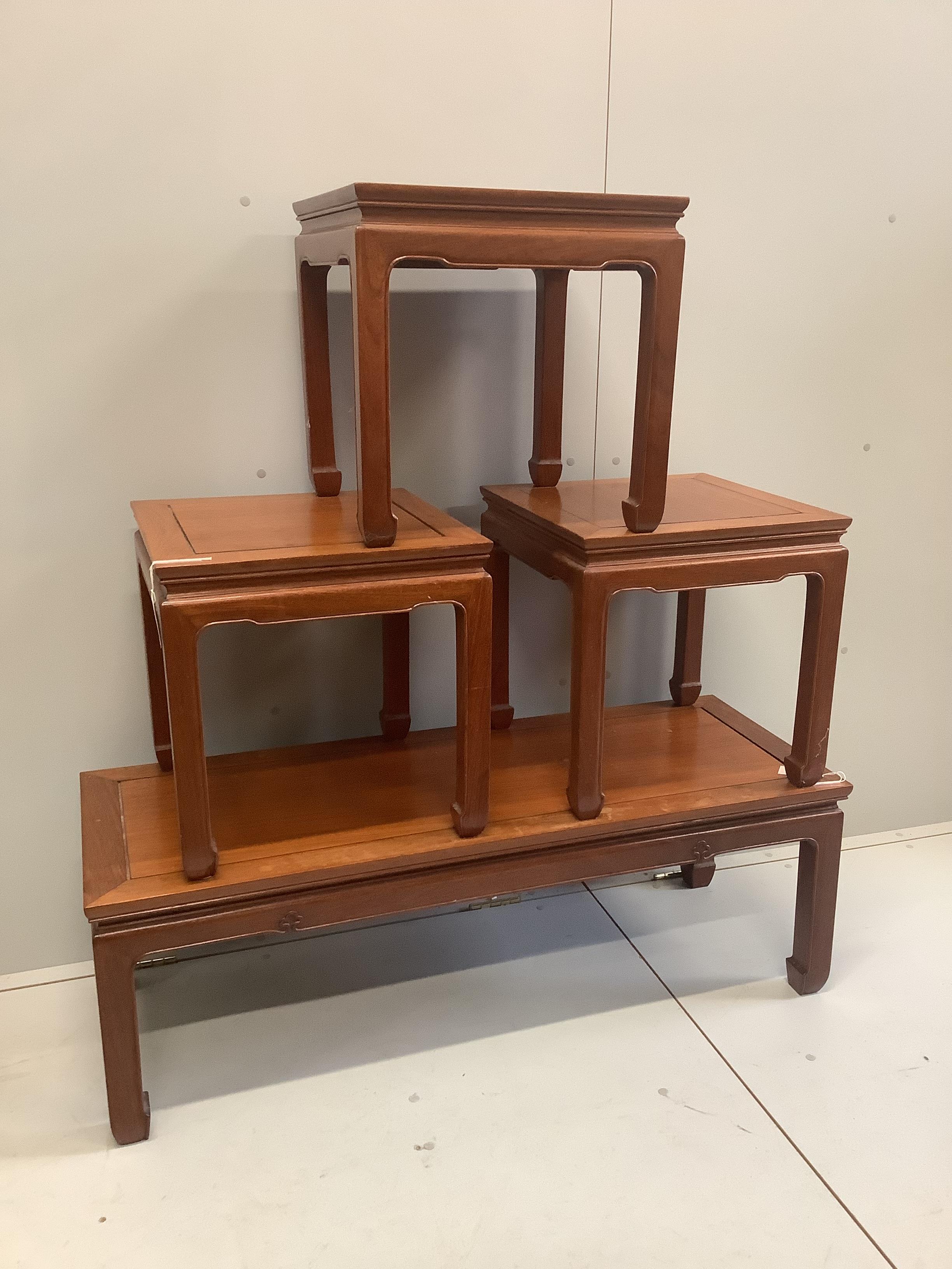 A Chinese hardwood coffee table and a set of three Chinese square topped hardwood tables, largest width 122cm, depth 46cm, height 41cm (4)